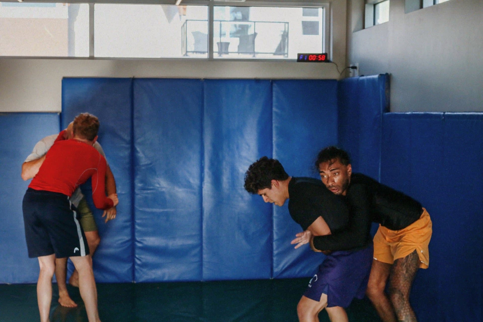Students working takedowns in pairs during class at Wiley Jiu-Jitsu YYC in Calgary