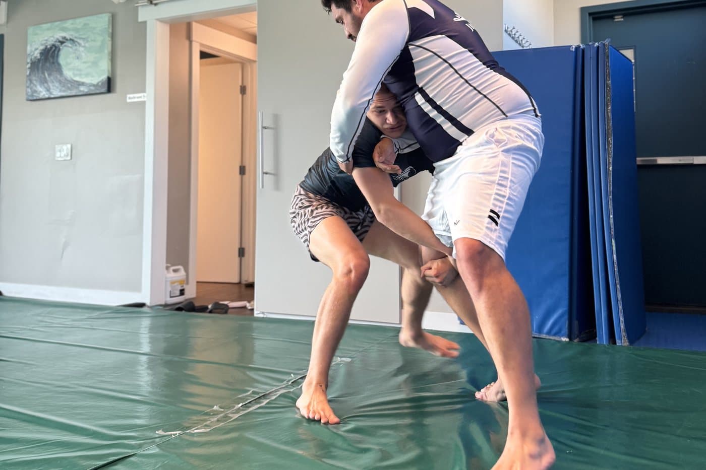 Two students working a takedown one-on-one at Wiley Jiu-Jitsu YYC in Calgary