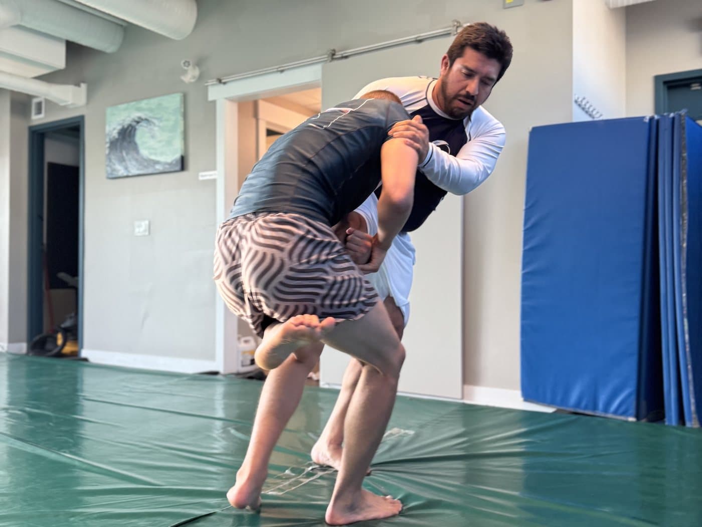 Two students working a standing clinch at Wiley Jiu-Jitsu YYC in Calgary